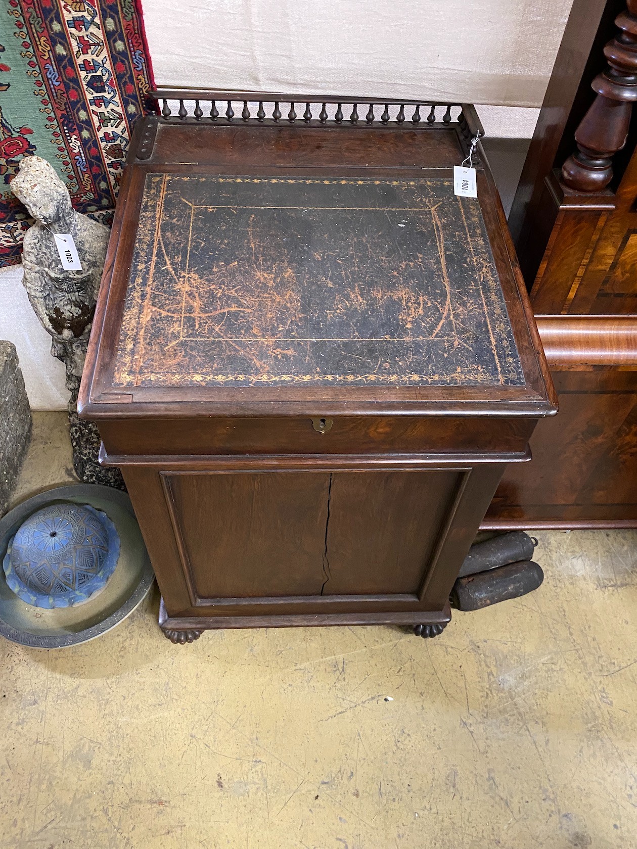A William IV rosewood Davenport with sliding top, width 60cm, depth 64cm, height 89cm